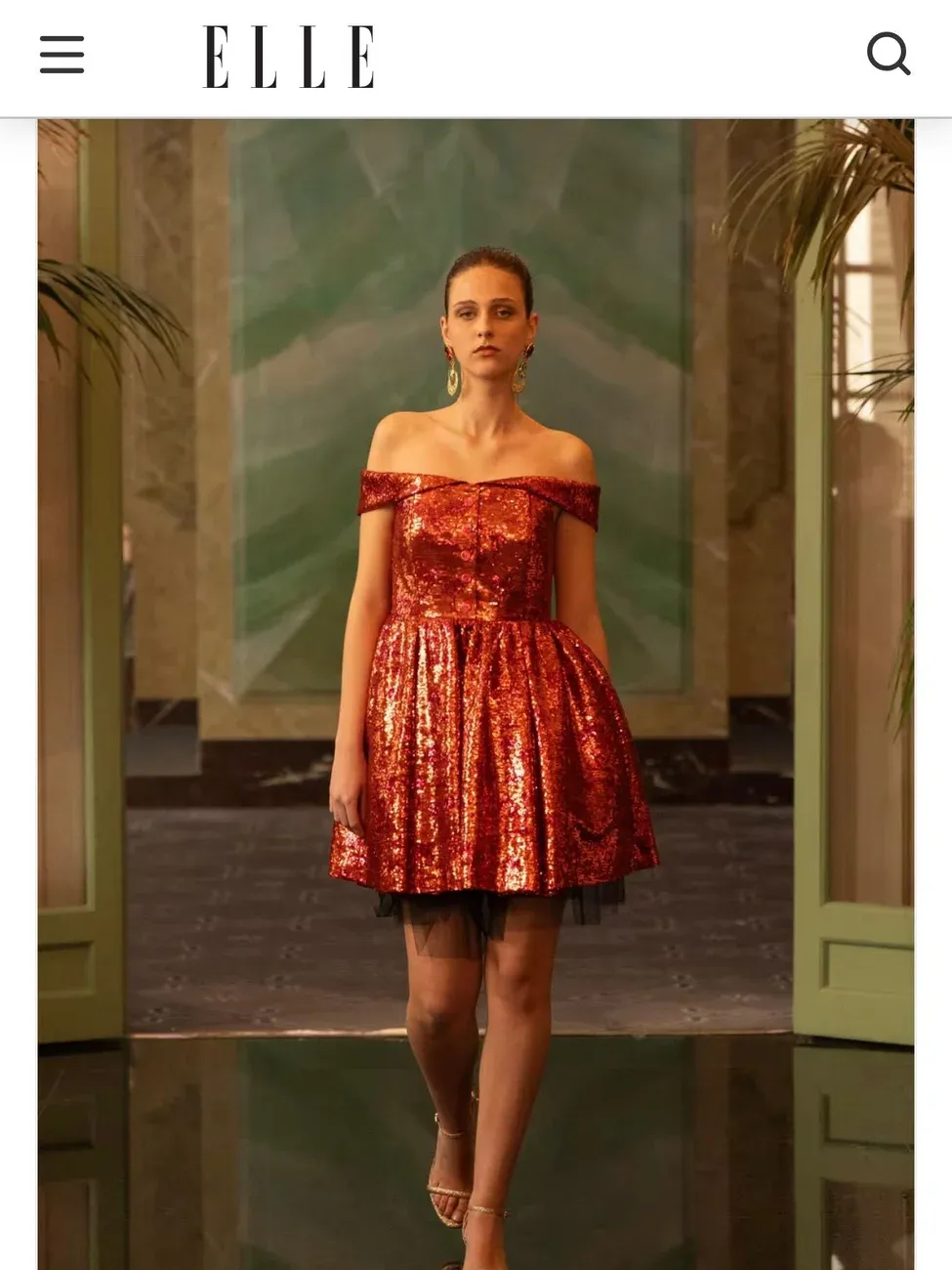 A model of Be Your Best Academy of Marbella in a red couture dress for an ELLE editorial feature.