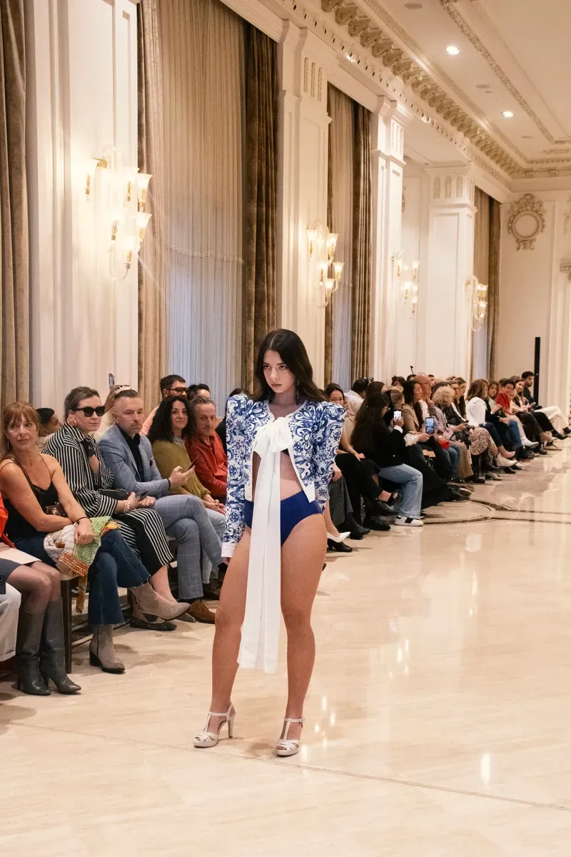 A student modelling at a fashion event.