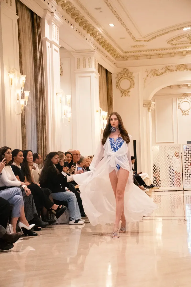 A young model of Be Your Best Academy on the runway at an international fashion show in Marbella.