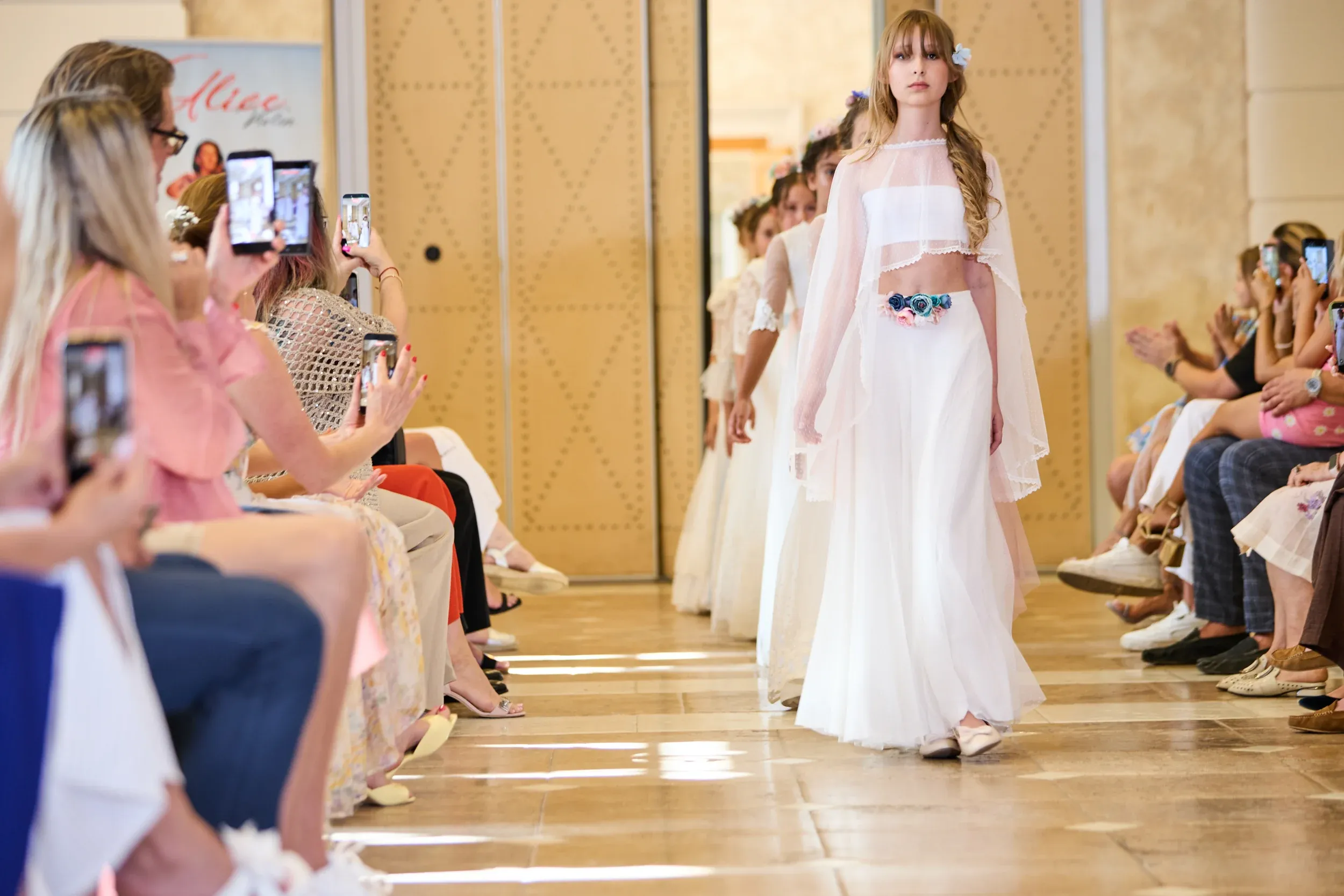 A young student walks the catwalk at a professional fashion show in Marbella, on the Costa del Sol.