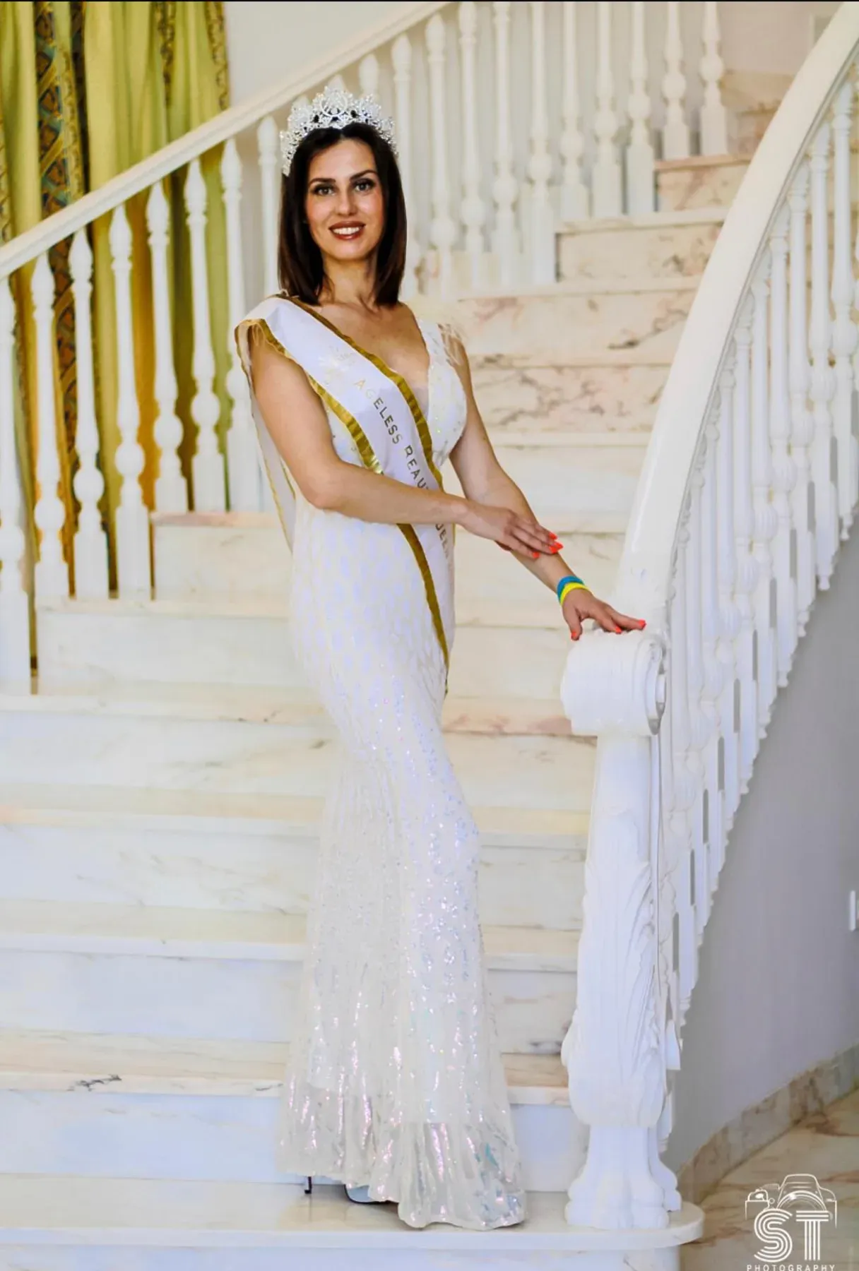 Iryna Malpa wearing a beauty-pageant gown and sash in London.