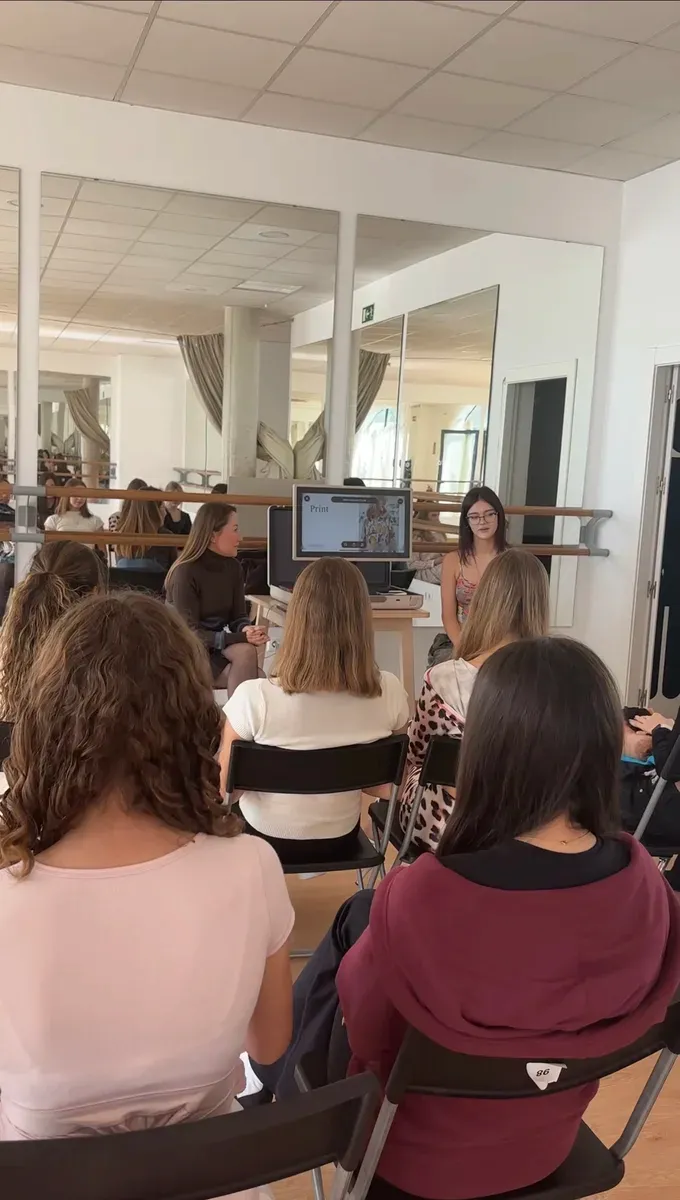 A student presenting to the class during a confidence-building exercise at Be Your Best Academy in Marbella.