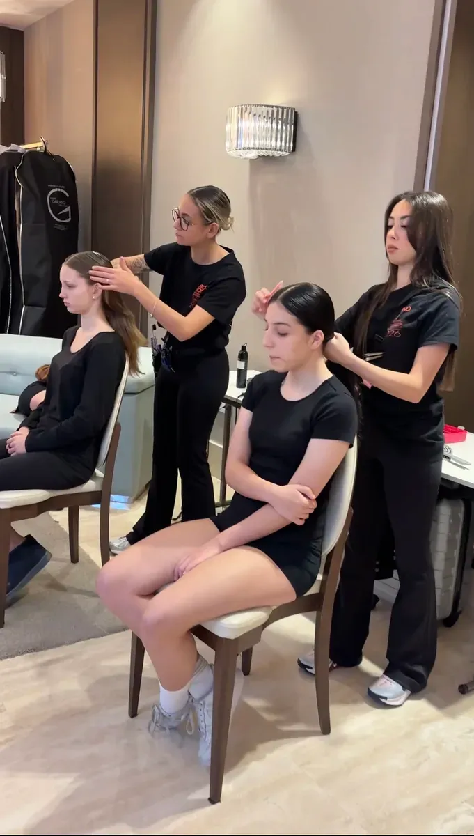 Students getting ready backstage before a fashion show in Marbella.