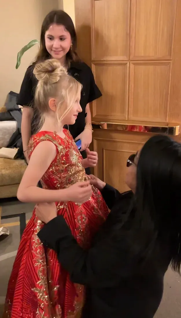 Students having their hair and makeup done backstage before a fashion show in Marbella.