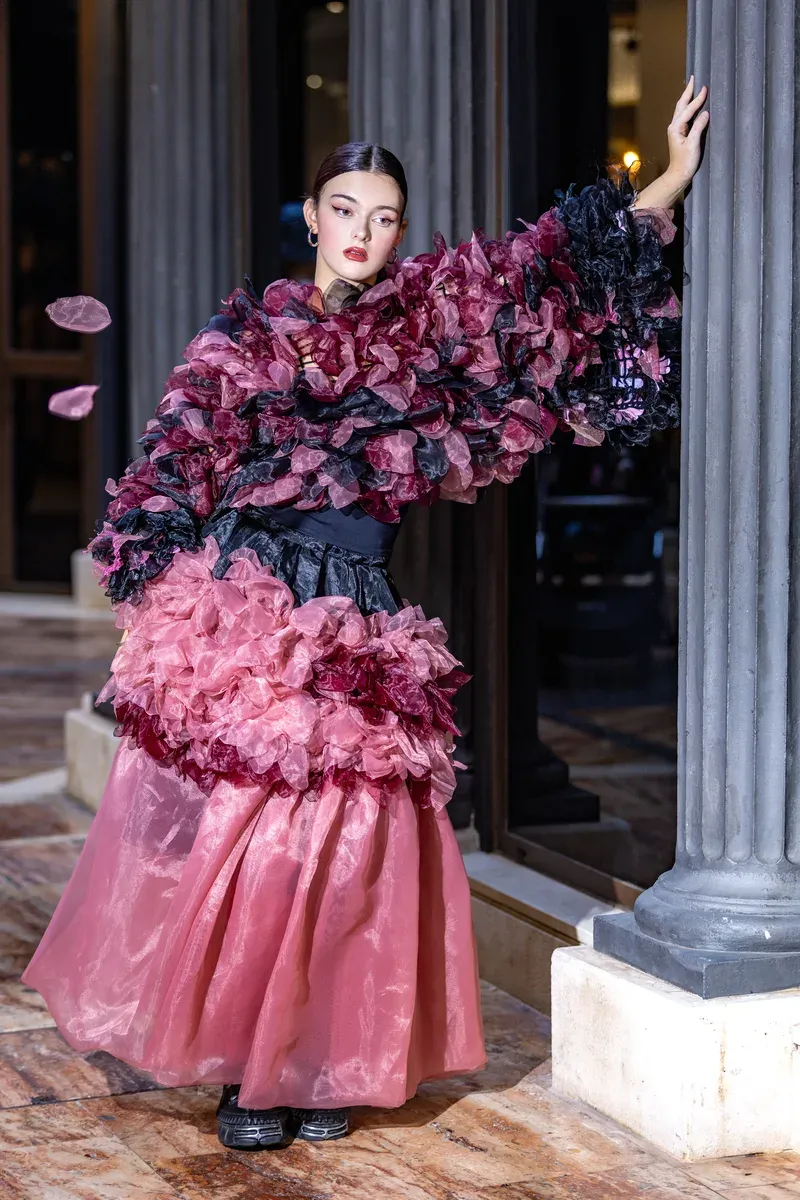 A student modelling a designer look during a professional photoshoot in Marbella.