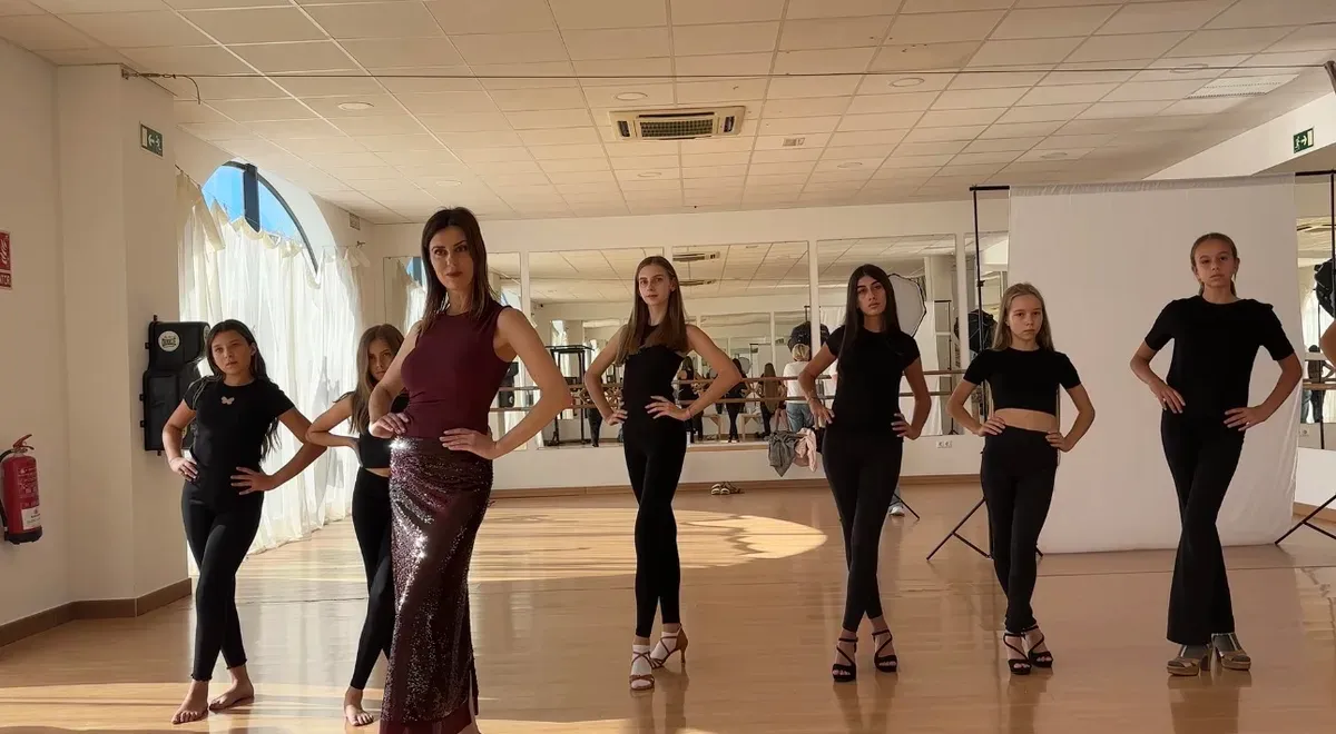Students practising modelling poses during a class in Marbella.