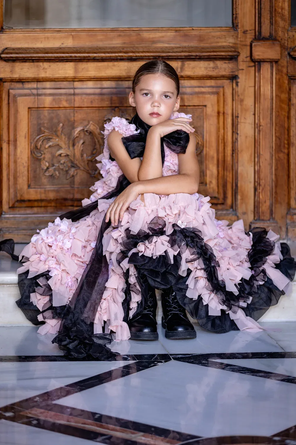 A young student modelling a couture look in a professional photoshoot.
