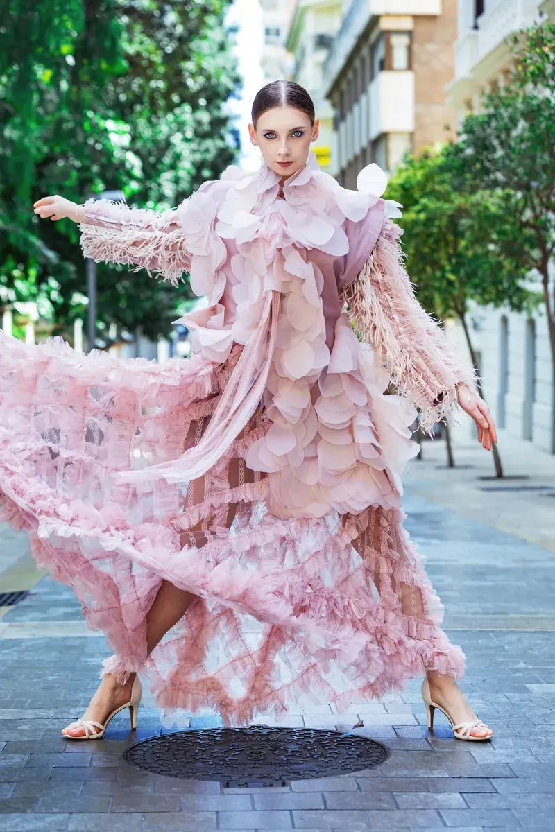 An outdoor fashion photograph of a model in Marbella.